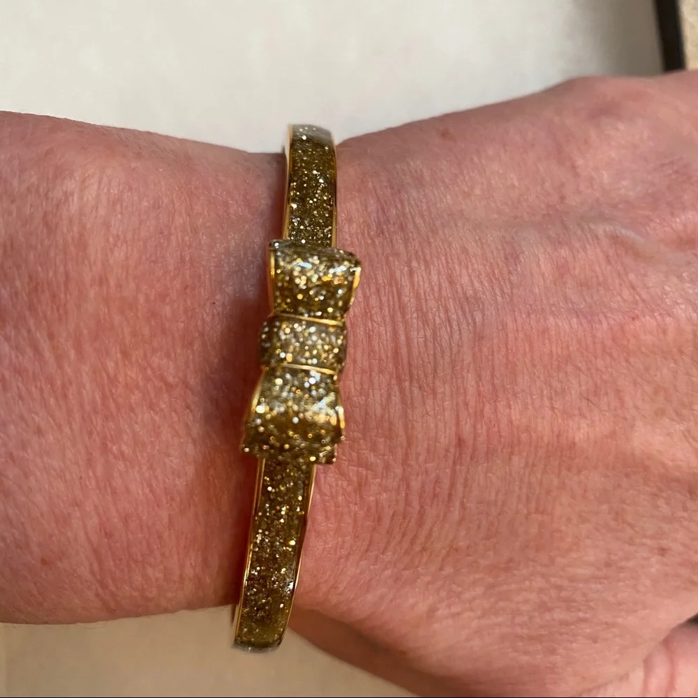 KATE SPADE NEW NWT BRACELET BANGLE GOLD PLATE GLITTER BOW MOON RIVER JEWELRY - Picture 4 of 7